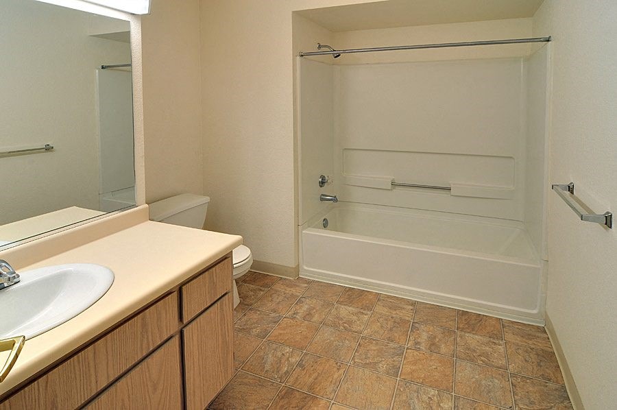 a bathroom with a bathtub and a sink