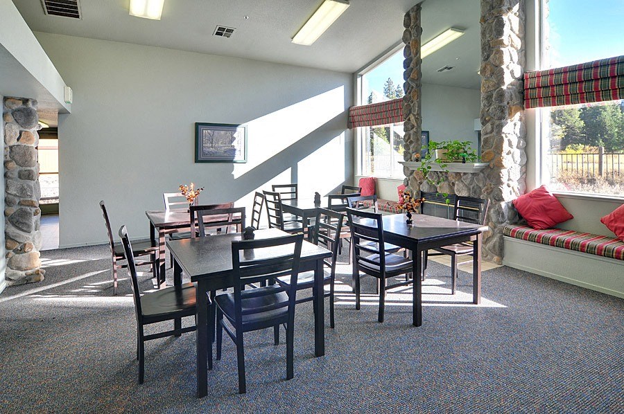 a dining room with tables and chairs