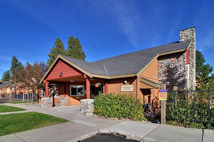 a view of the front of the building with a blue sky in the background