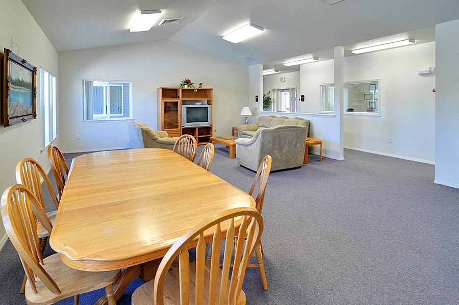 the dining room and living room of a house
