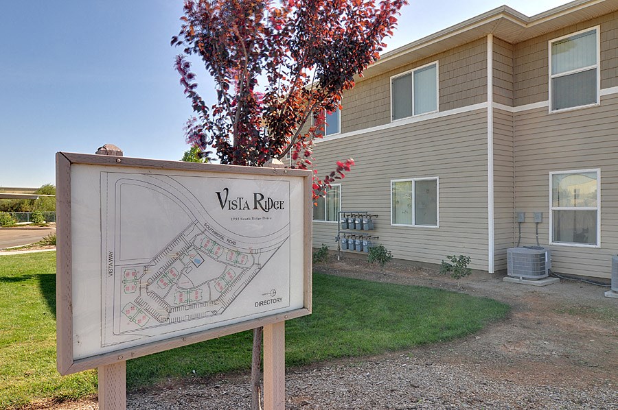 a house with a sign in front of it