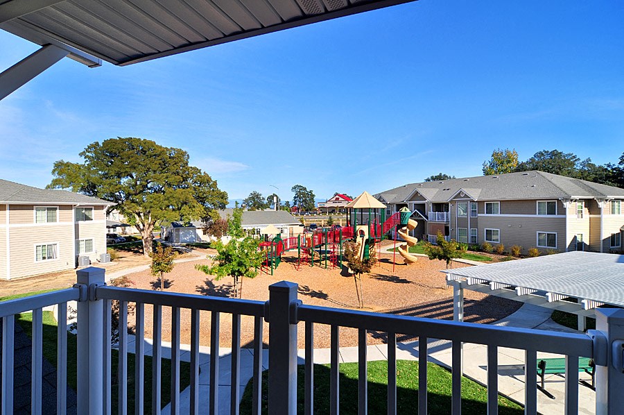 take in the playground and picnic area at the enclave at woodbridge apartments in sugar land,