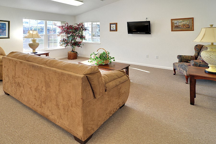 a living room with a couch and two chairs