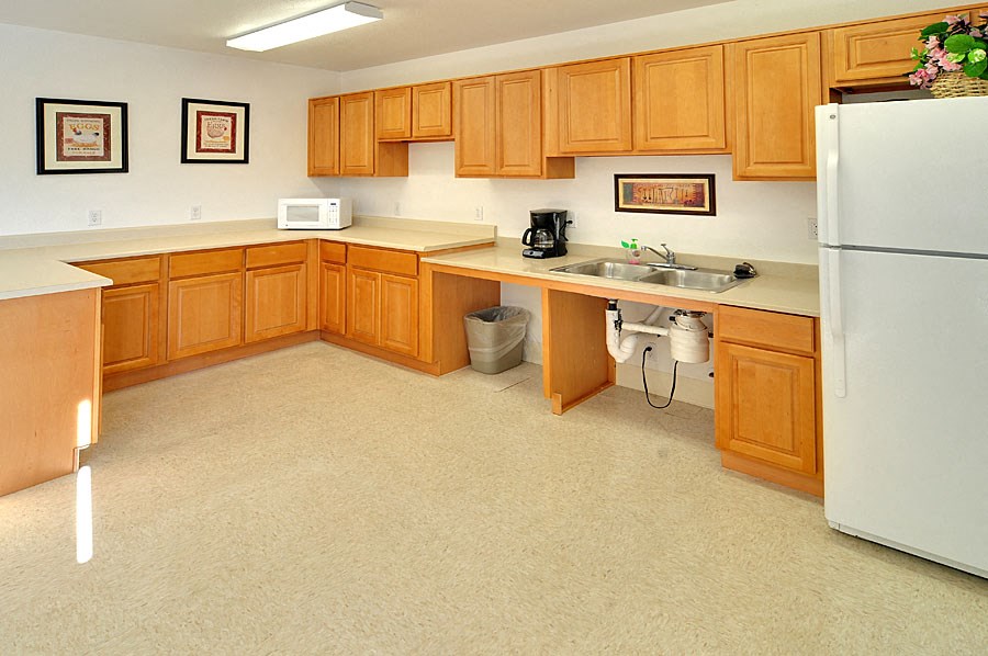 a kitchen with a sink and a refrigerator