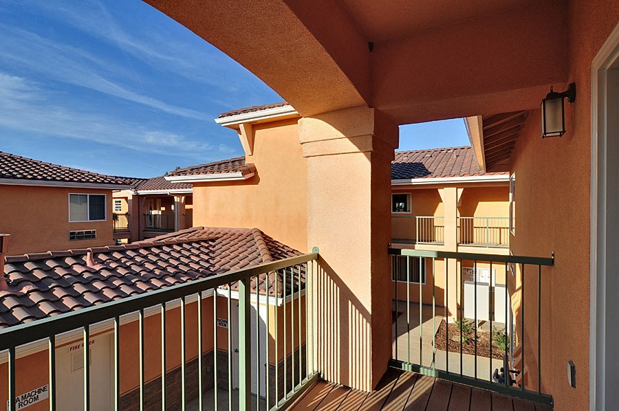 a balcony with a view of a house