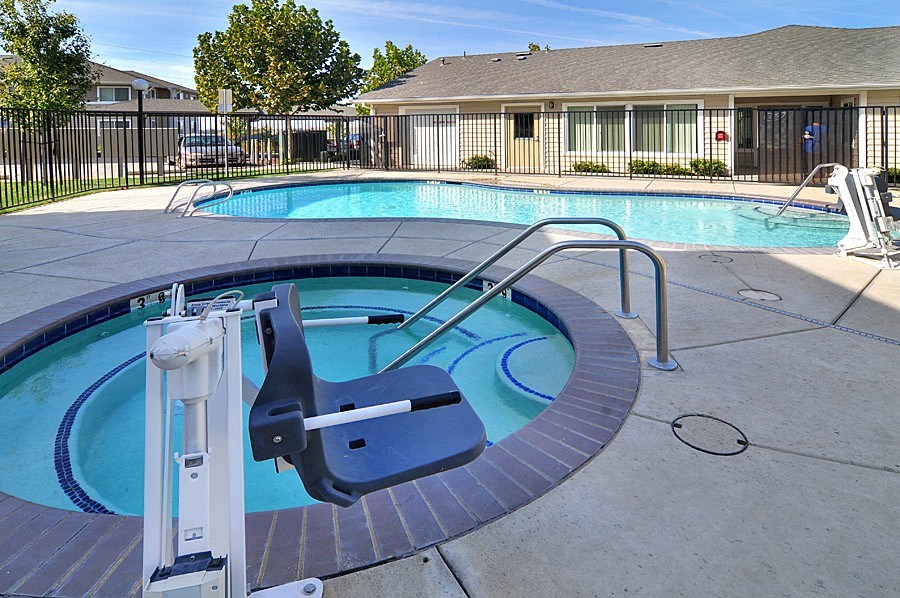 a swimming pool with a diving board in the middle