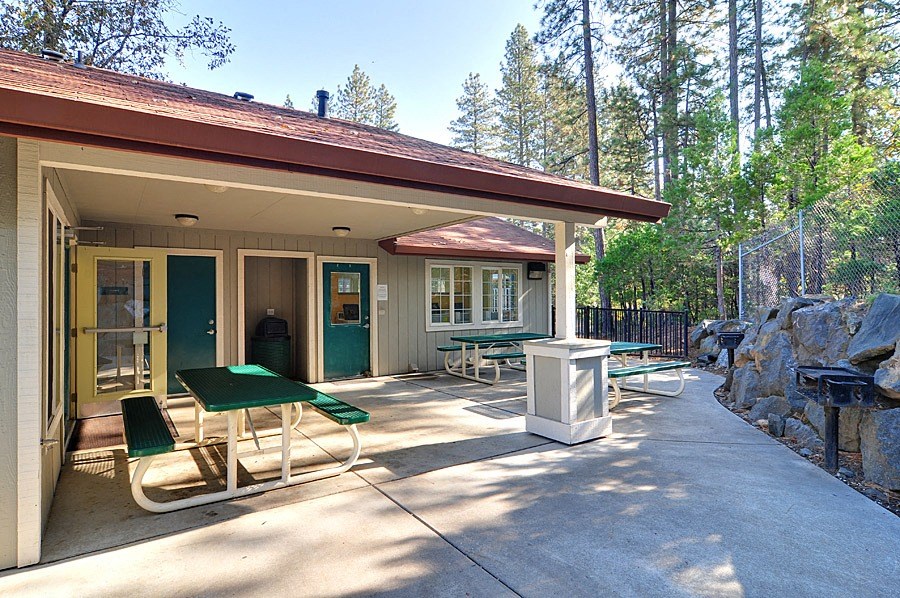 our apartments have a large patio with tables and chairs