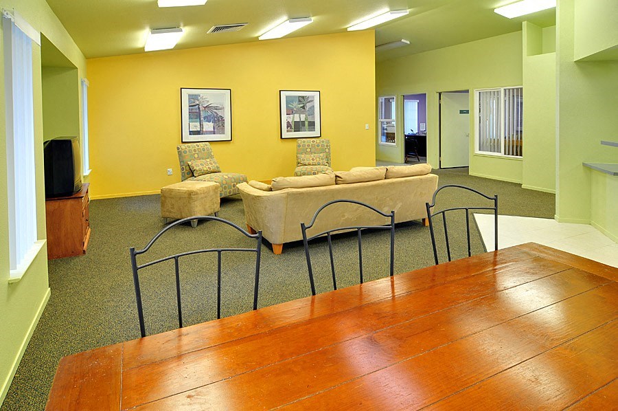 a lounge area with couches chairs and a table