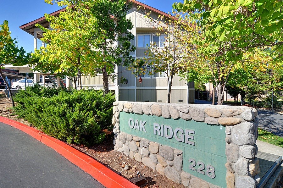 a sign that says oak ridge in front of a building