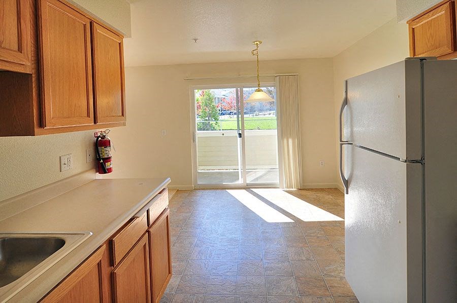 a kitchen with a refrigerator freezer and a sink