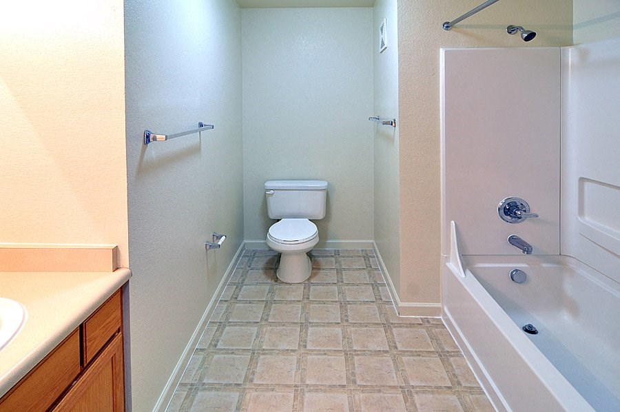 a bathroom with a toilet sink and bathtub