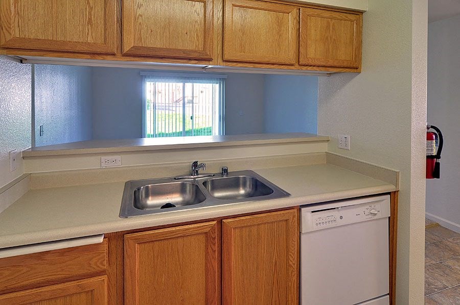 a kitchen with a sink and a dishwasher