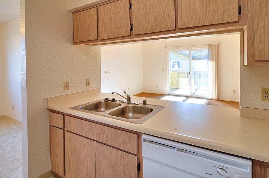 a kitchen with a sink and a dishwasher