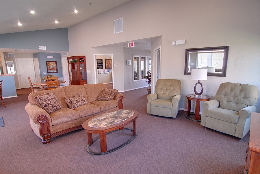 a living room with a couch and two chairs