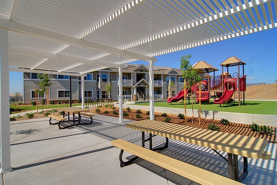 our apartments have a playground and picnic area with benches