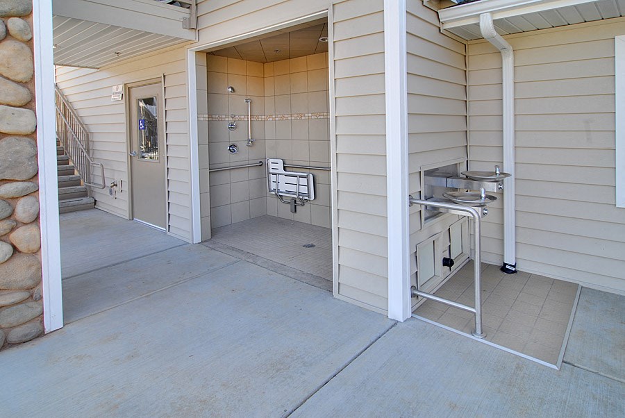 the porch of a home with a sink and a laundry room