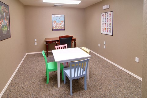 a dining room with a table and chairs