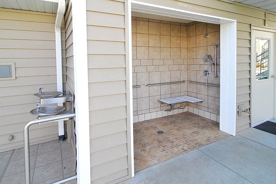 a bathroom with a shower and a sink in it