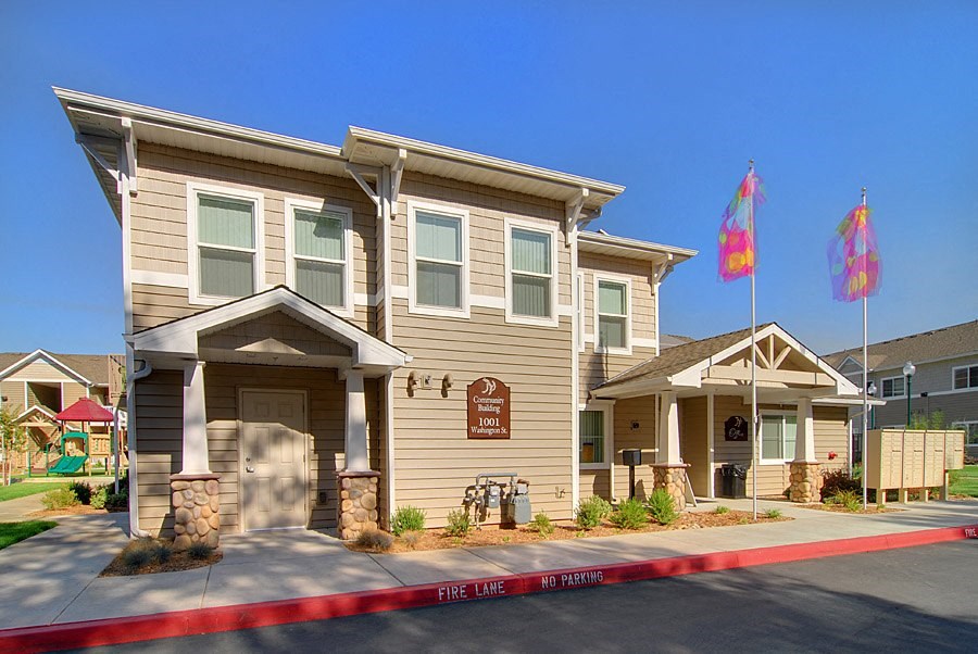a house with two flags in front of it