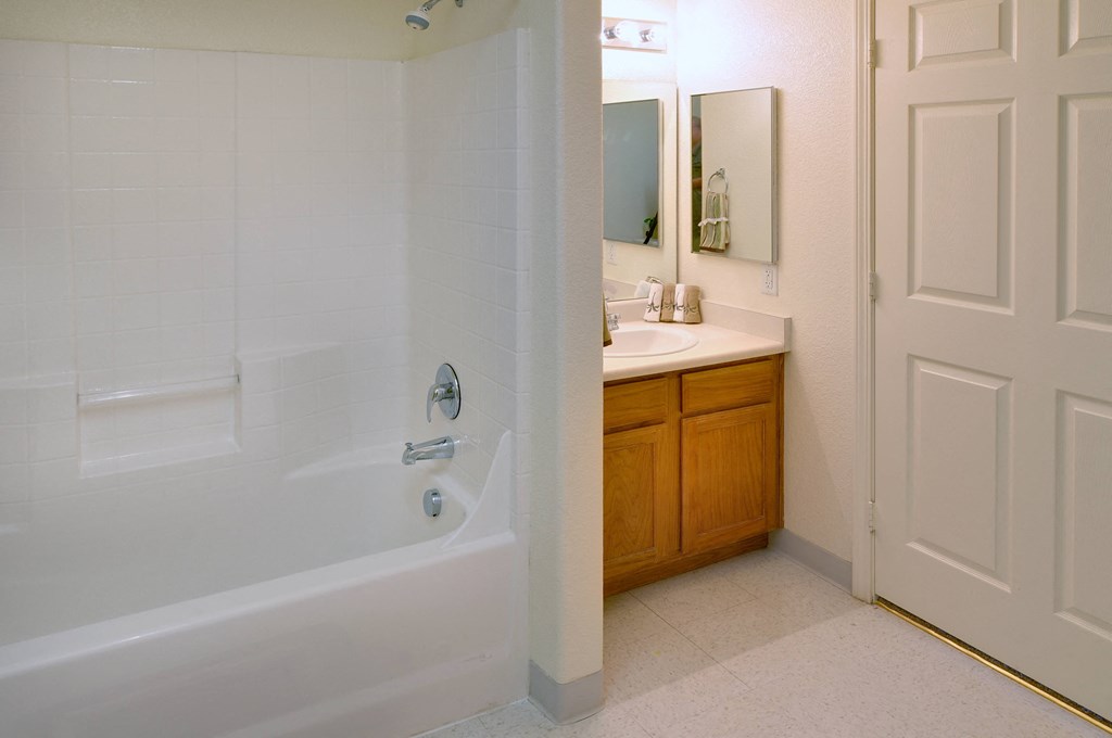 a bathroom with a bathtub and a sink