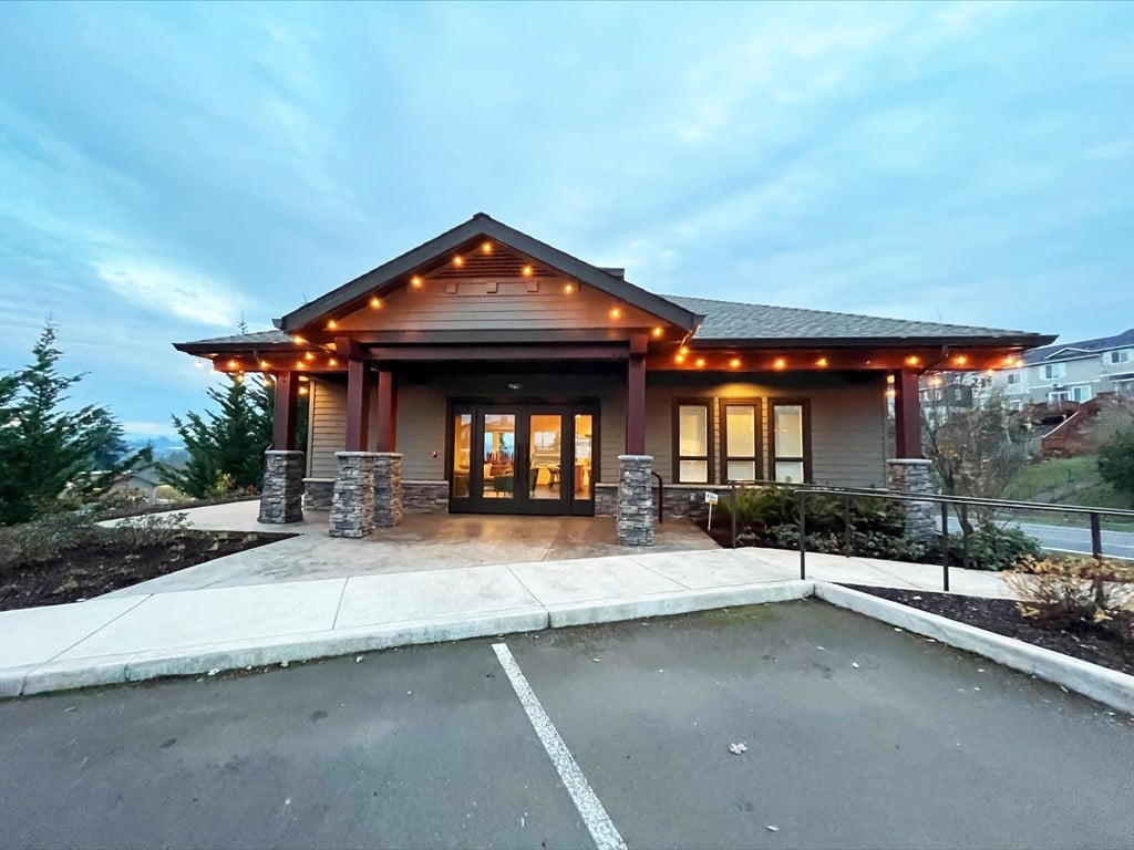 a rendering of the front of a building with lights on it