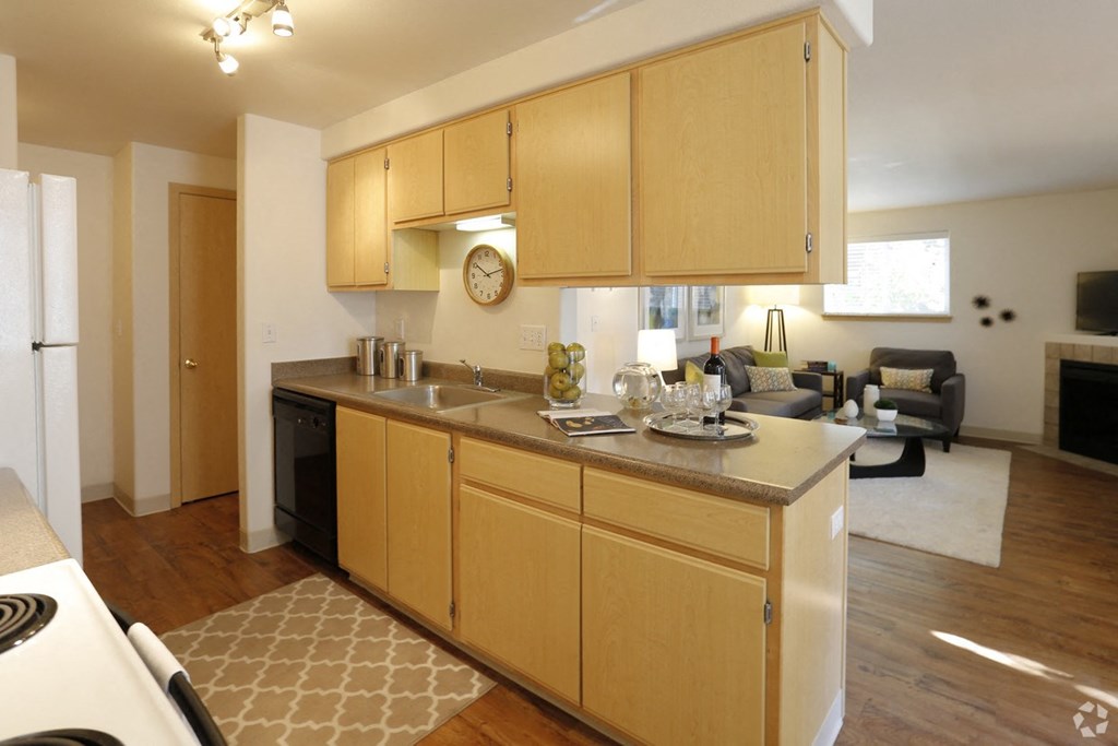 a kitchen and living room of an apartment