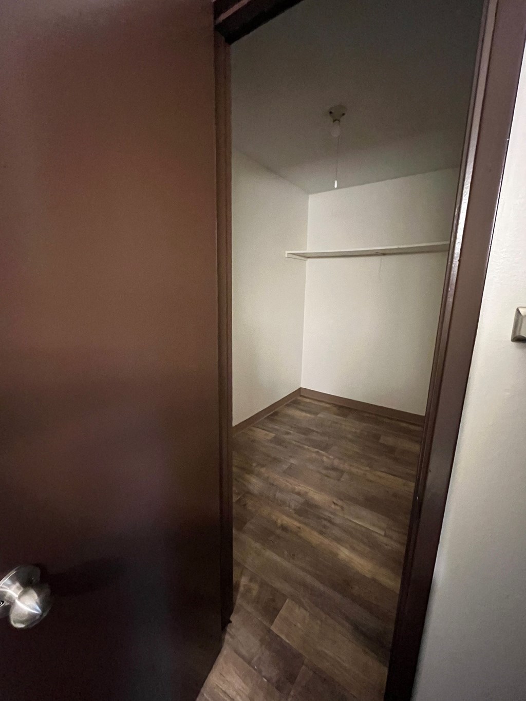 a small room with a big closet in it