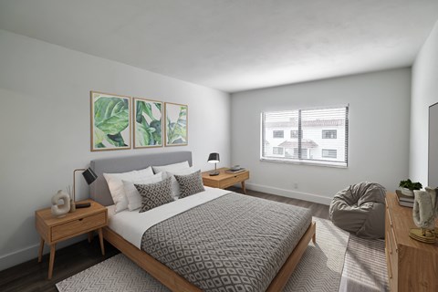 a bedroom with a large bed and a window