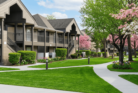A building with a green lawn in front of it.