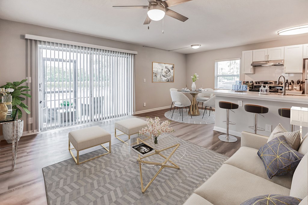 A modern living room with a grey rug and a white sofa.