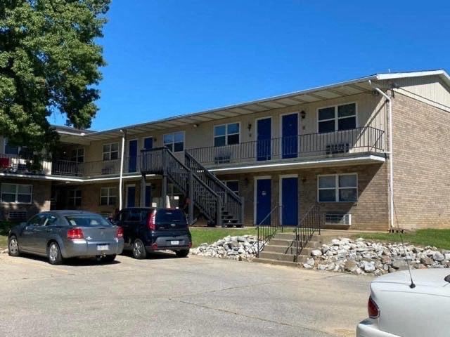 a building with cars parked in front of it