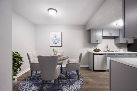 A dining room with a table and chairs.