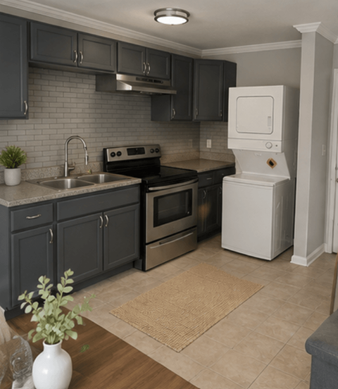 A kitchen with a white fridge and a black oven.