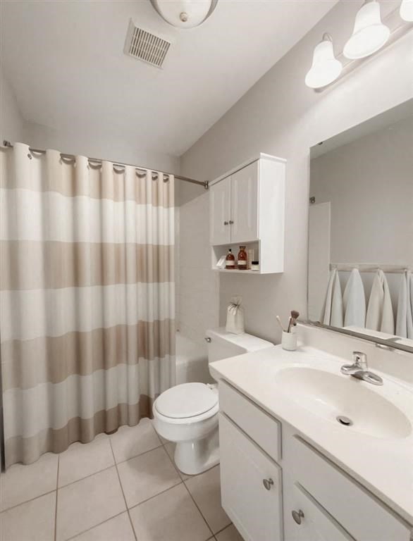 a bathroom with a toilet and a sink and a shower