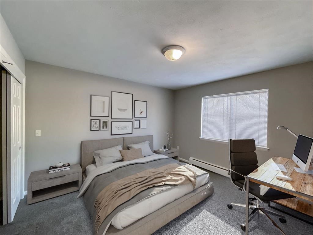 a bedroom with a bed and a desk