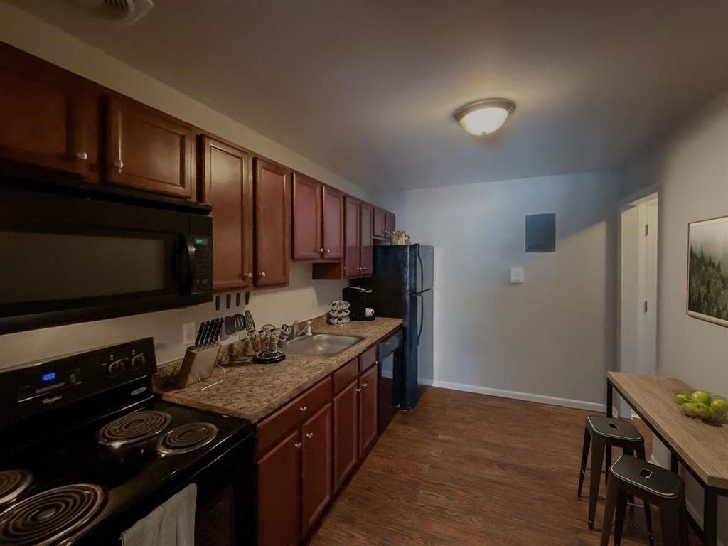 a kitchen with a stove and a sink