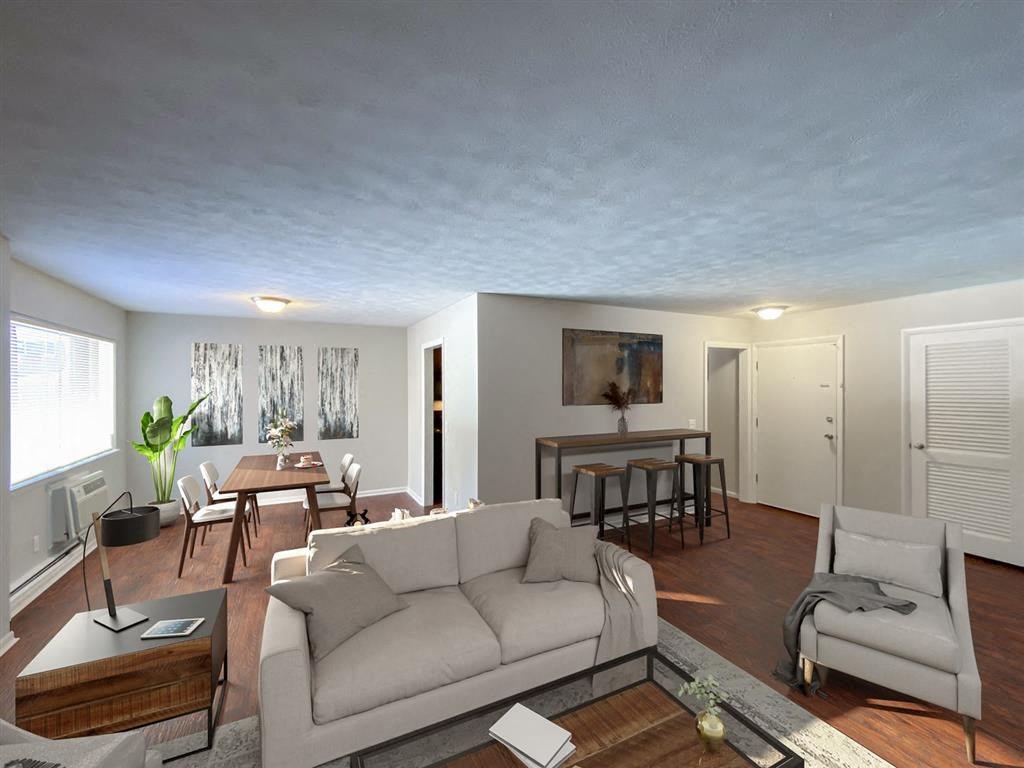 a living room and dining room with a couch and a table