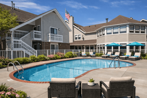 A large house with a pool in the backyard.