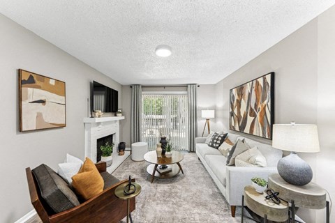 a living room with a couch and a fireplace