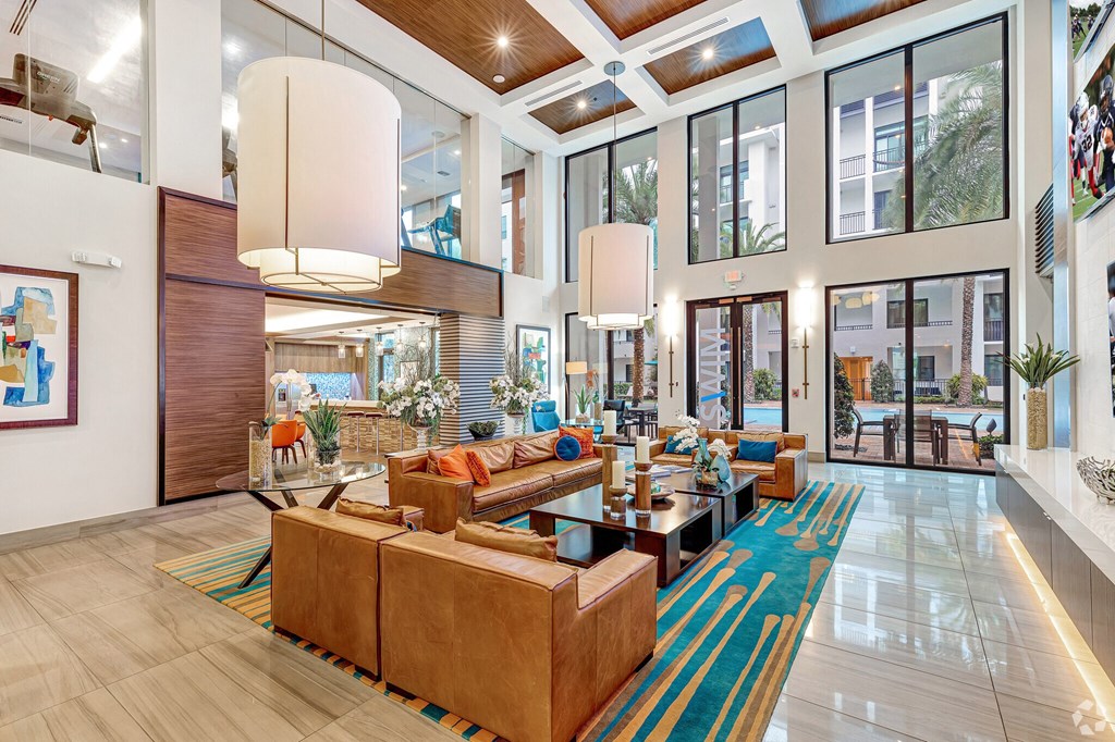a large lobby with couches and a coffee table