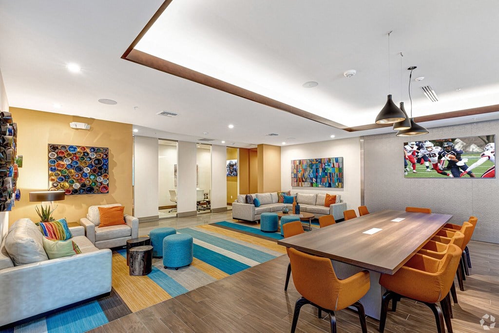 a living room with couches and chairs and a table