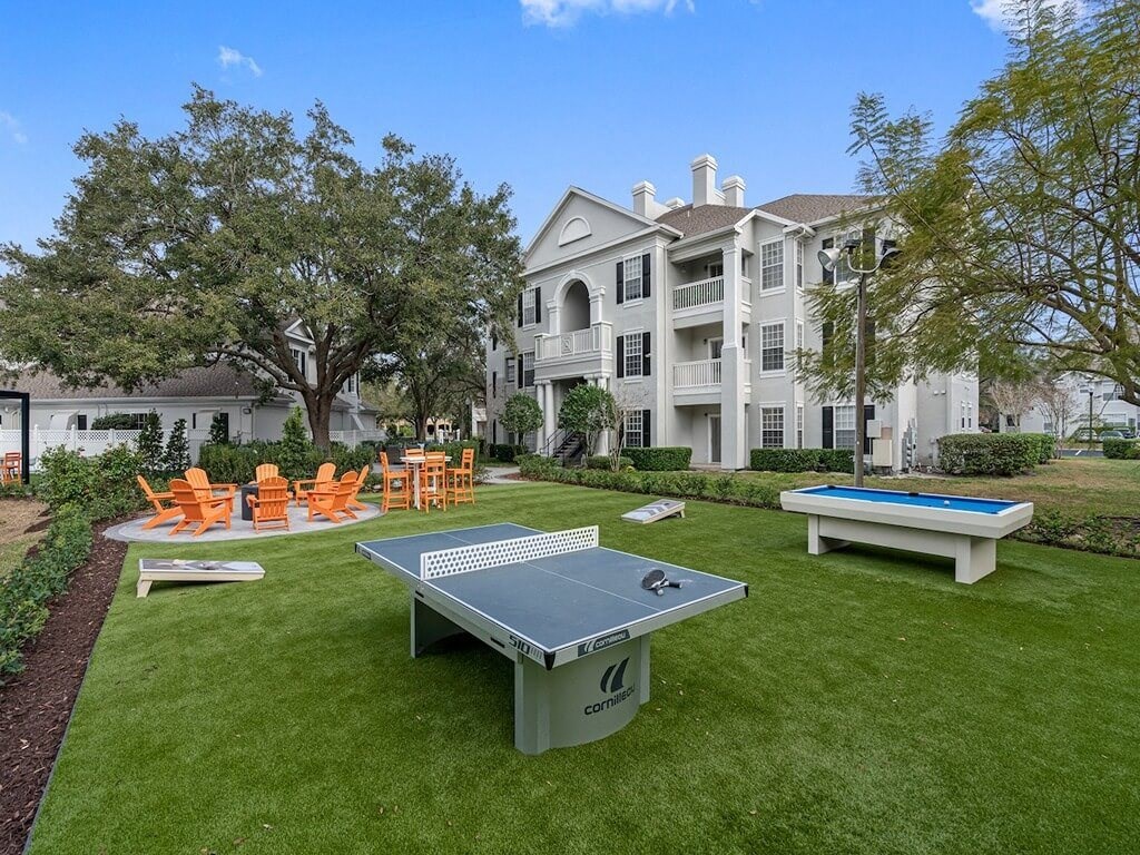 Outdoor amenity area with Ping Pong, Pool table, fire pit and seating