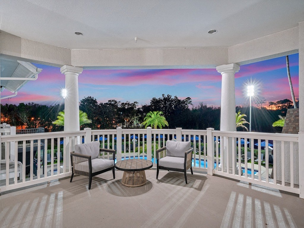 Private patio overlooking the resort style swimming pool