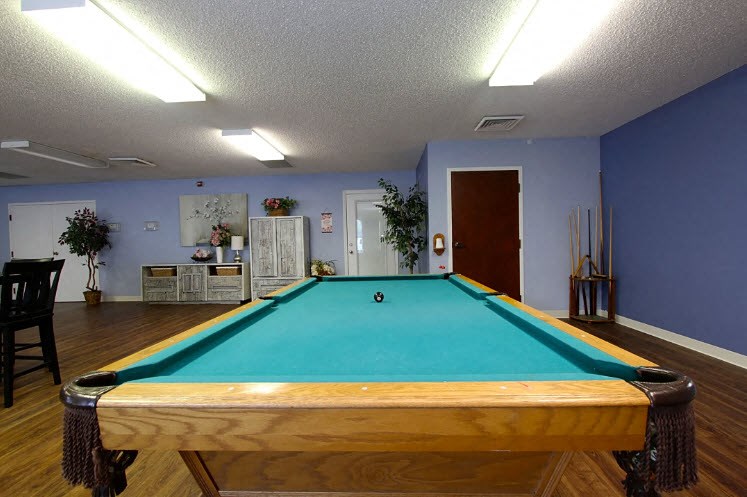a pool table in the center of a room