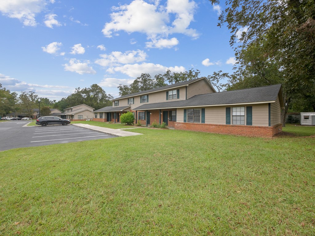the view of a house with a parking lot