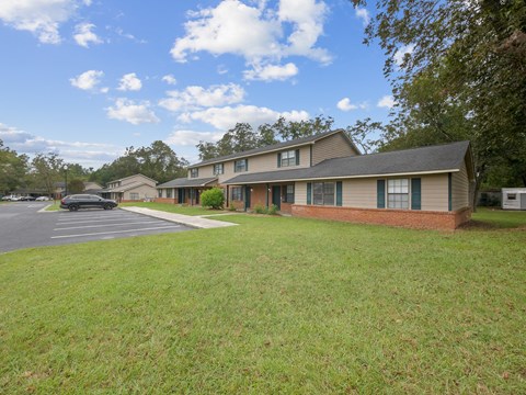 the view of a house with a parking lot
