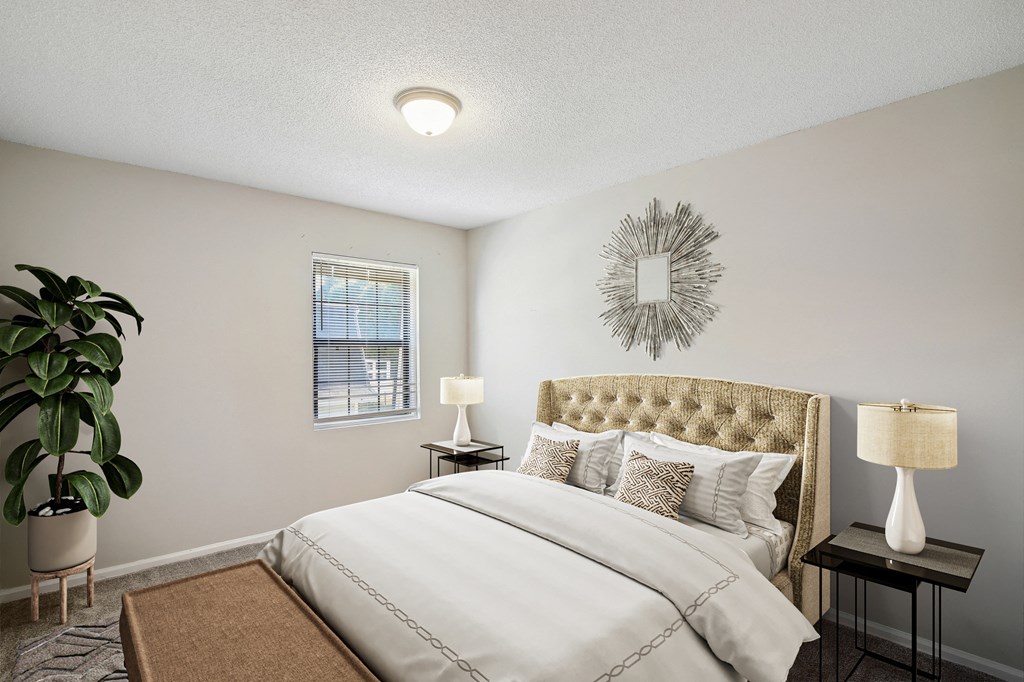 our apartments offer a bedroom with a bed and a plant