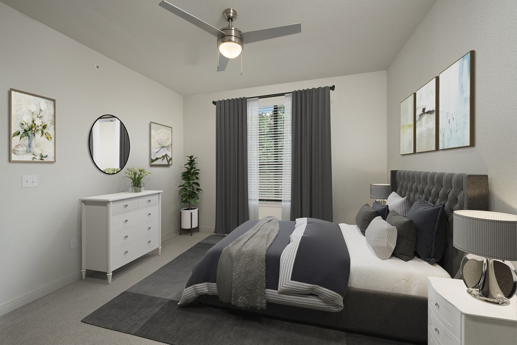 an image of a bedroom with a bed and a ceiling fan
