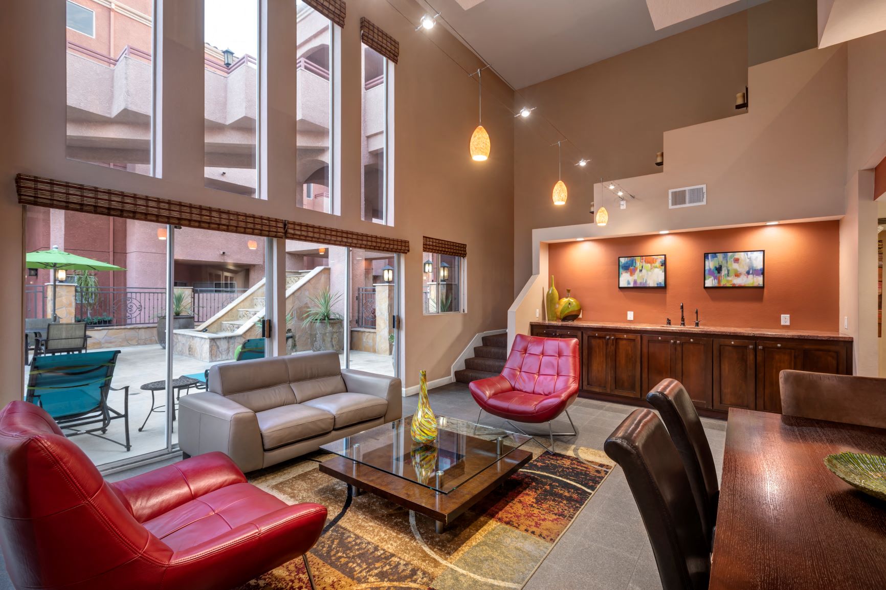 a living room with couches and chairs and a table