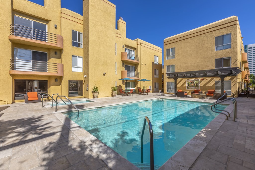 Apartments in Burbank, CA -  Pool and Patio with Lounge Chairs, Tables and Umbrellas
